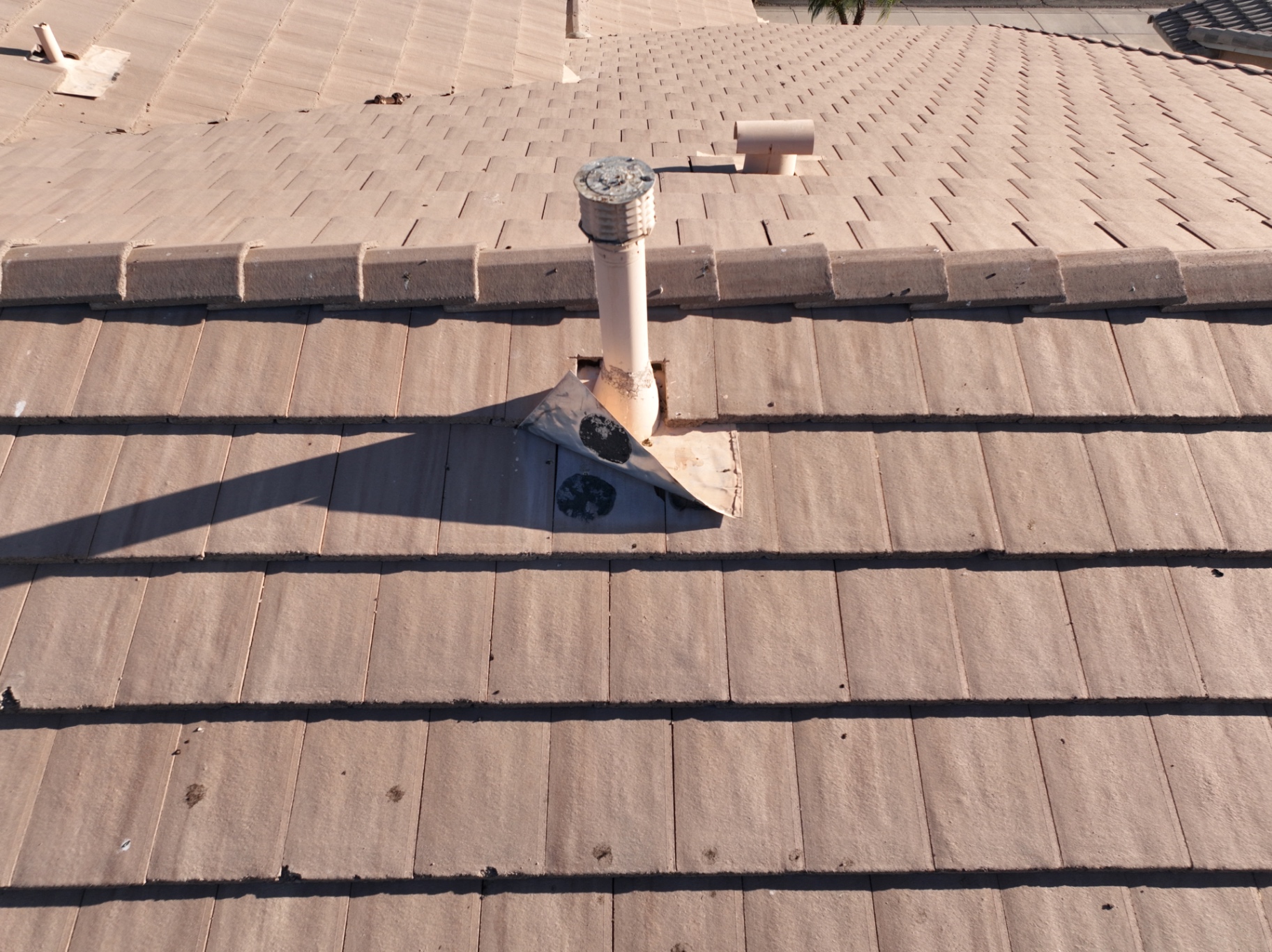 Failed pipe jack flashing on tile roof