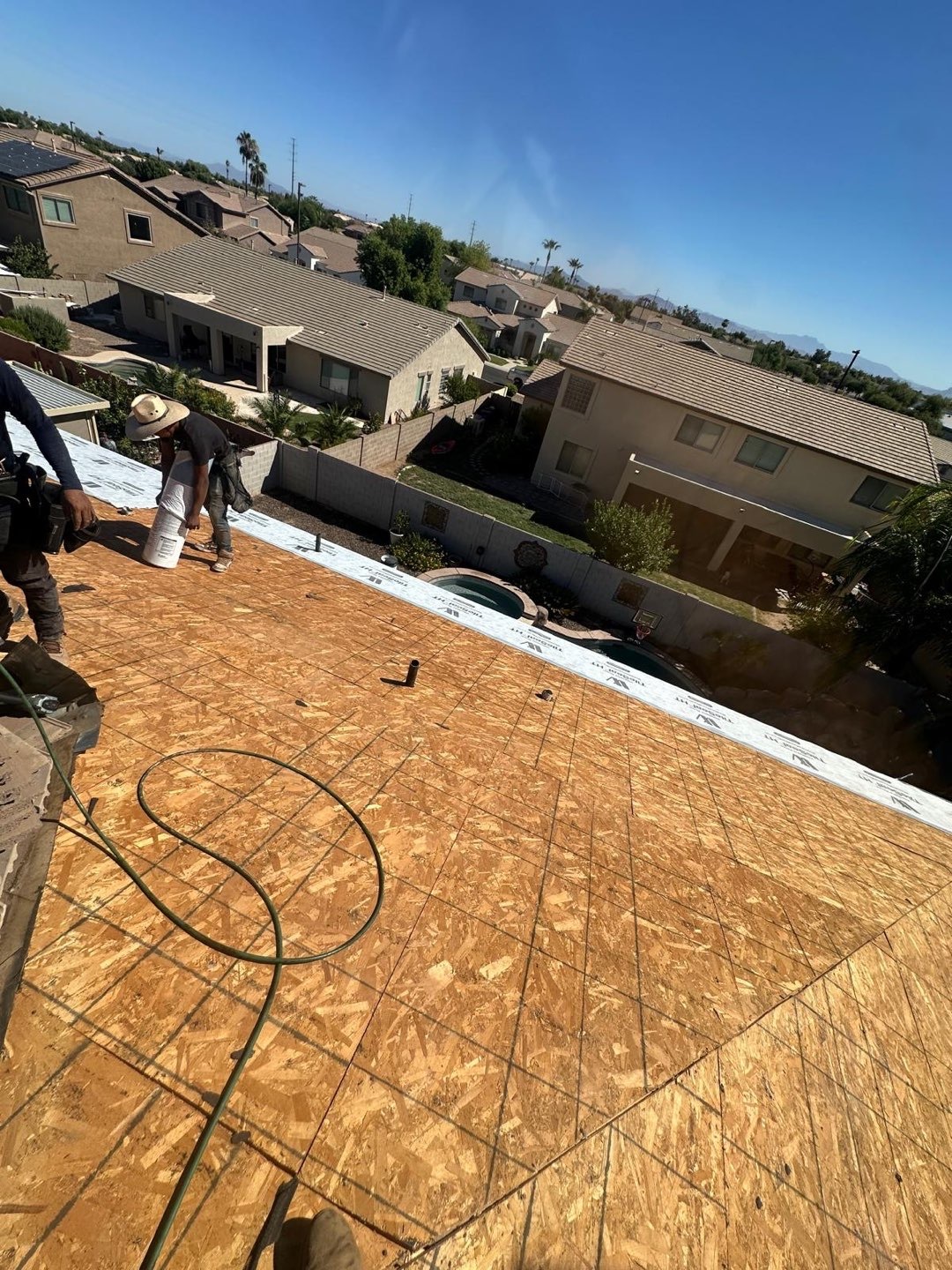 Exposed roof deck with new sheathing before underlayment