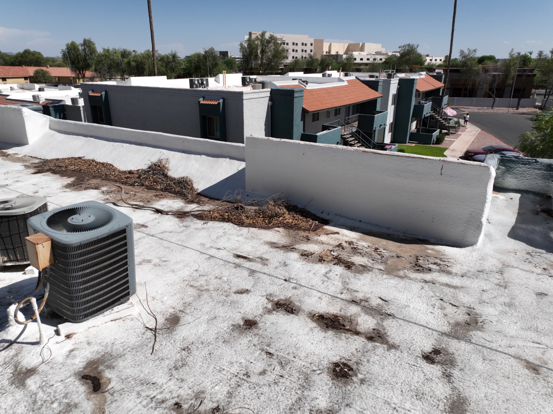 Foam roof debris and residential apartment complex in Chandler AZ
