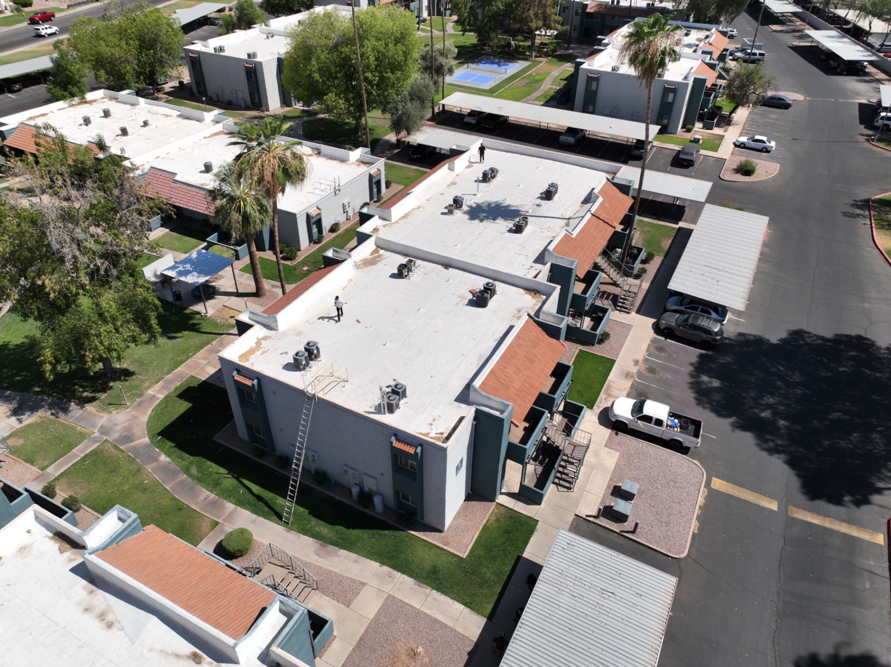 Aerial drone view of a spray polyurethane foam (SPF) roof inspection on a Chandler AZ apartment complex by Power Peak Roofing