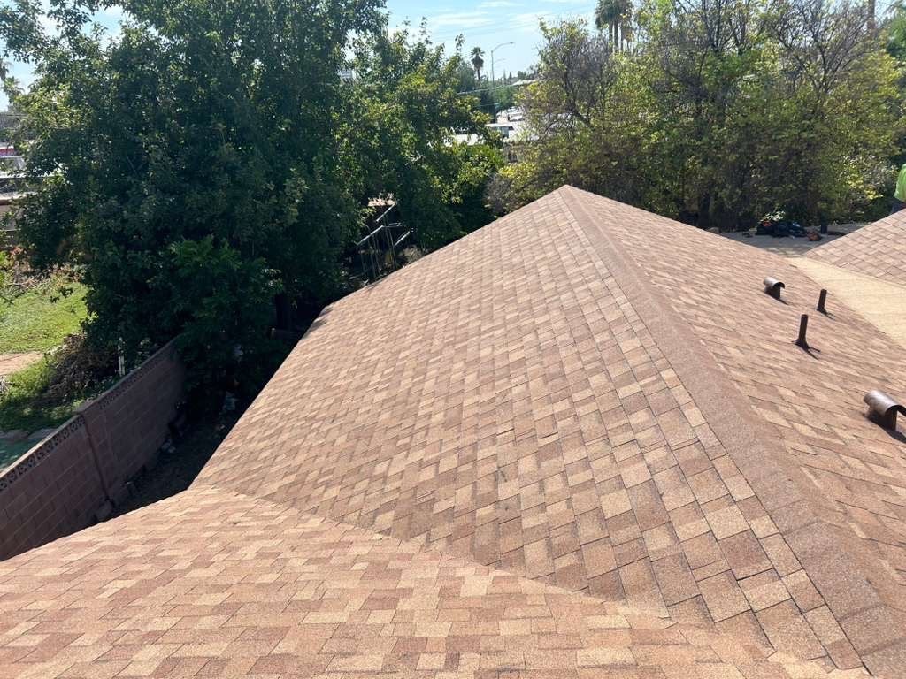 Completed brown architectural shingle roof on Mesa home main slope