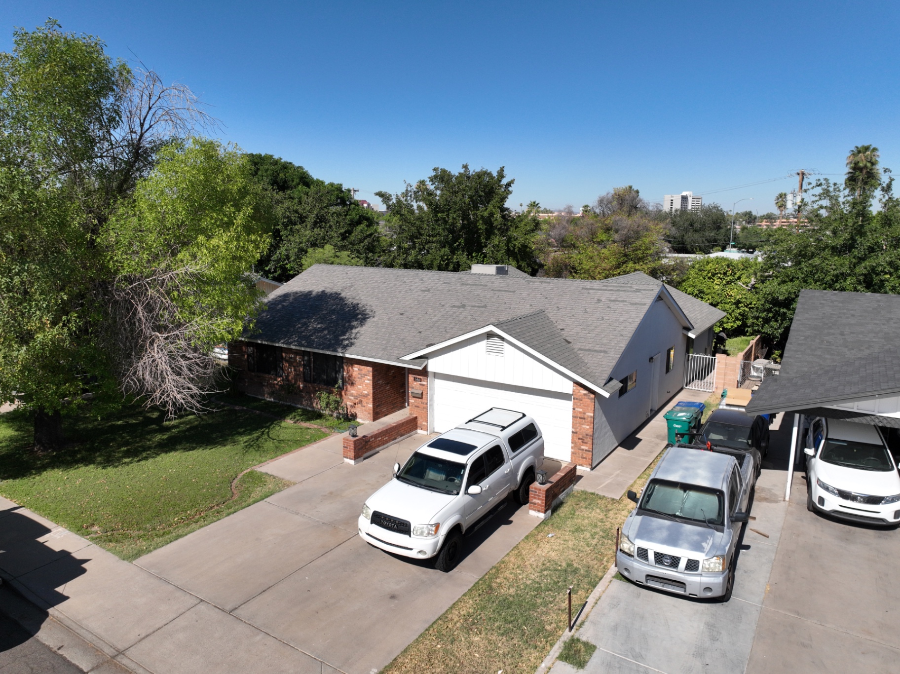 Aerial view of a Mesa AZ home before roof replacement showing weathered gray shingles