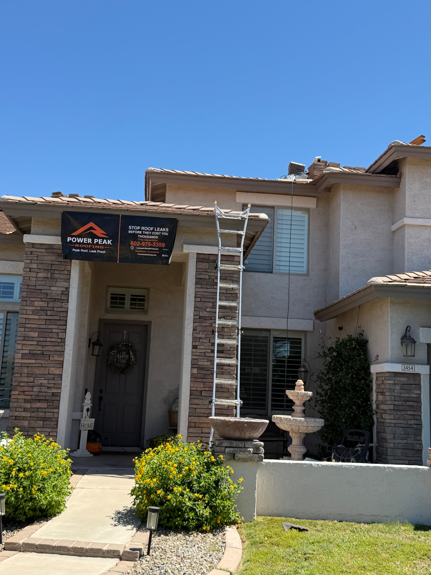 Power Peak Roofing banner on Gilbert AZ tile job site