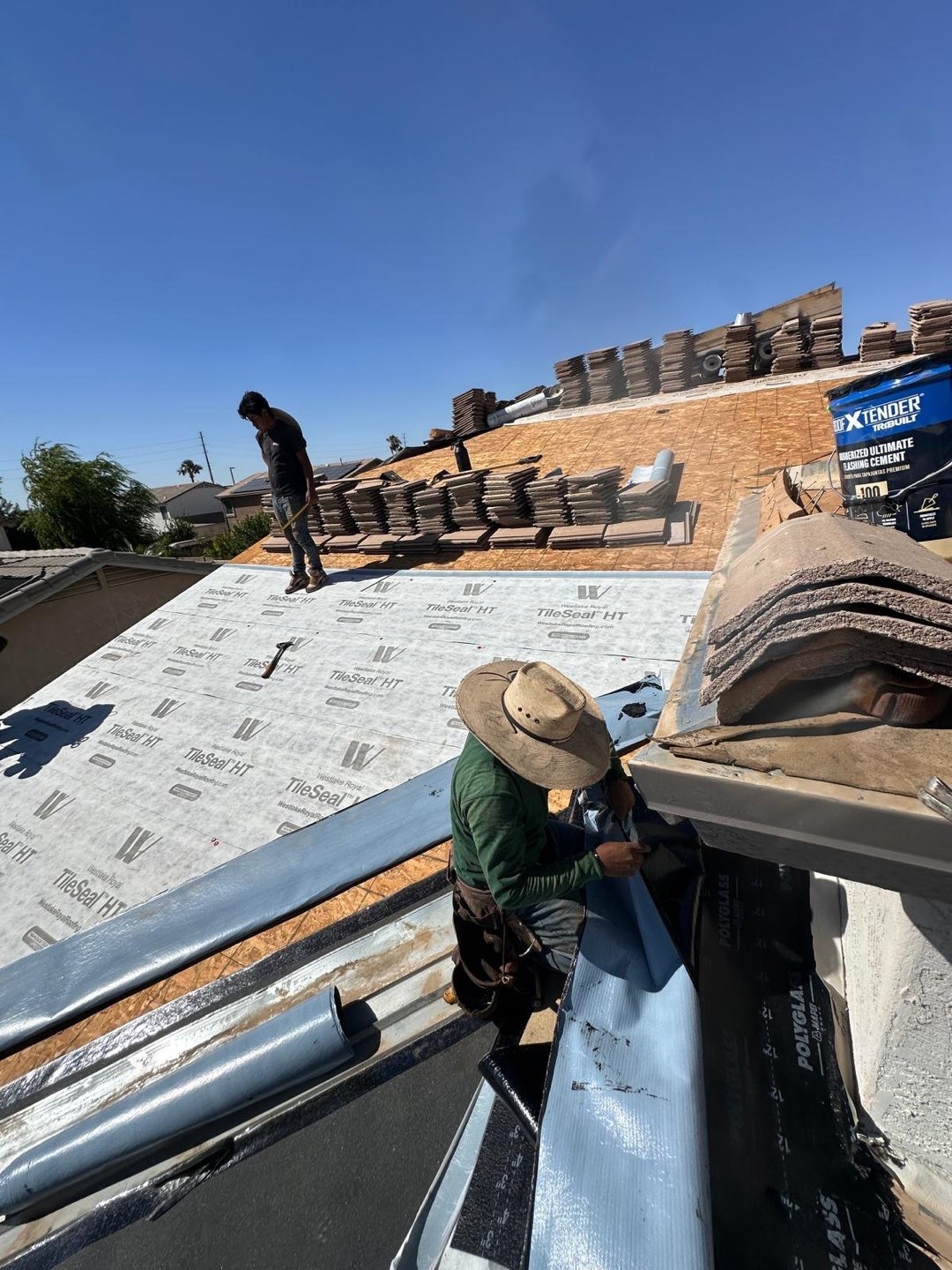 Crew installing new flat concrete tile
